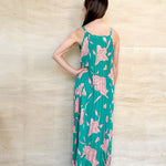 green dress with floral on, spaghetti strap, v neckline, pleated dress