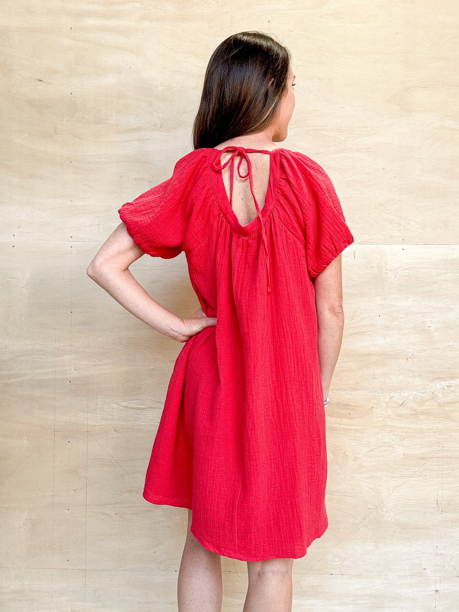 red gauze dress, short sleeve, buttons down the front, round neckline, mini length