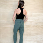 green stretch pants, thick waistband, pockets, waffle material, 