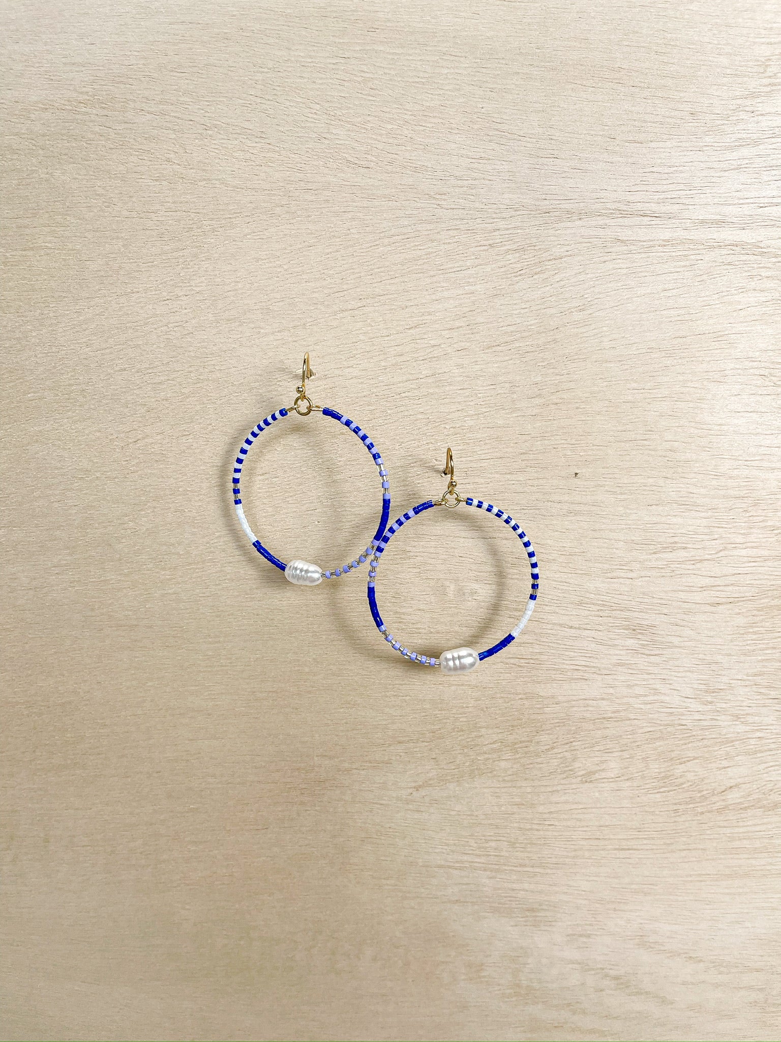 blue beaded hoop earrings, pearl accent