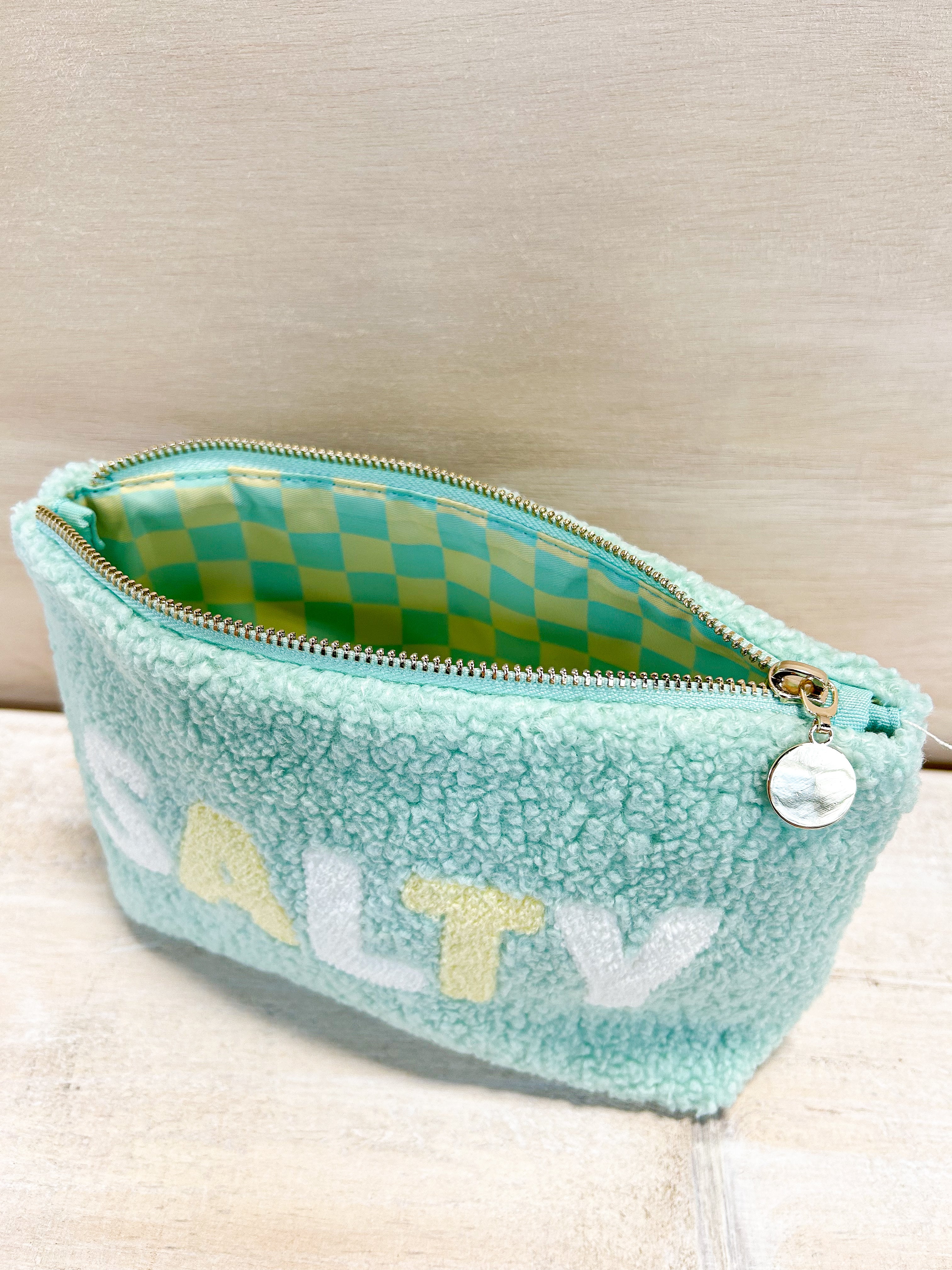 Salty teddy pouch, sherpa material, zipper closure,  checkered inside