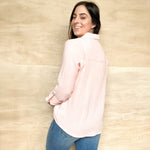 pink gauze shirt, double lined, buttons down the front and sleeve, collared